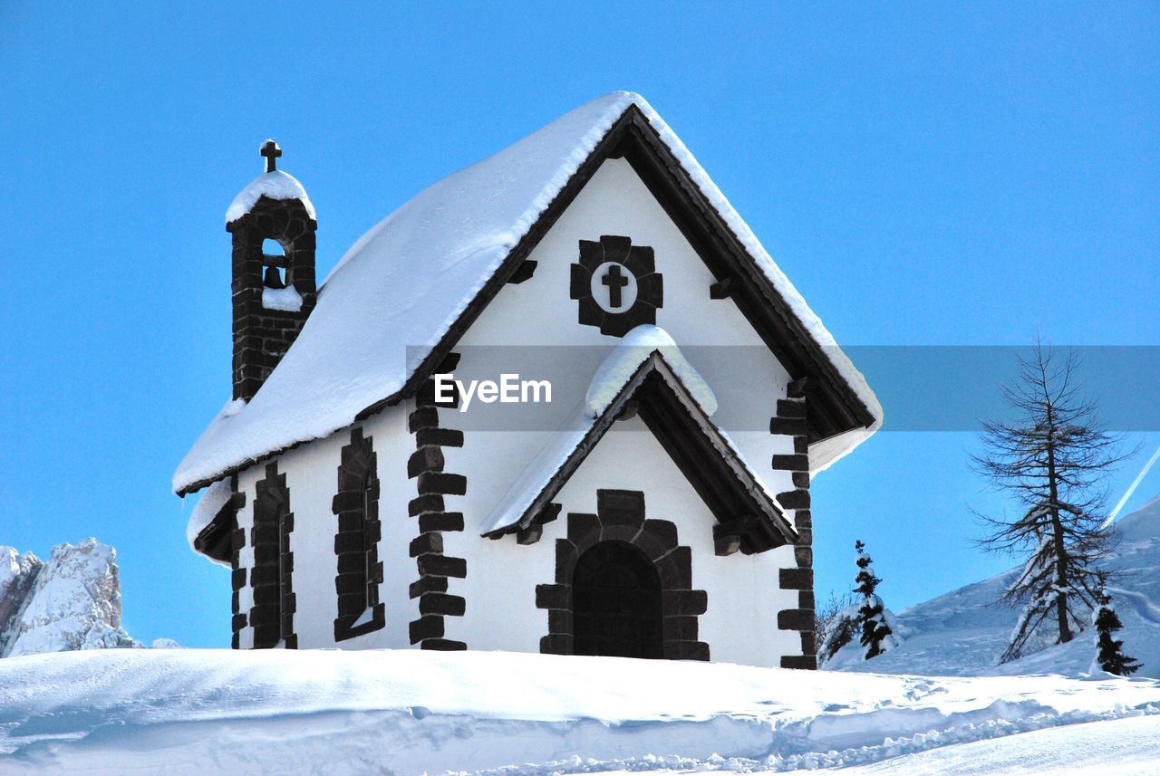 Low angle view of church against sky during winter