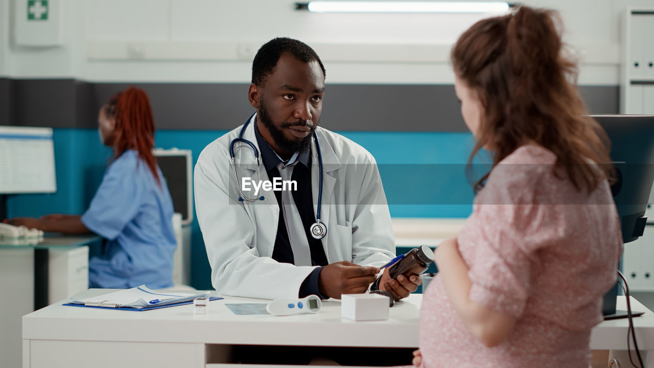 Female doctor examining x-ray in hospital