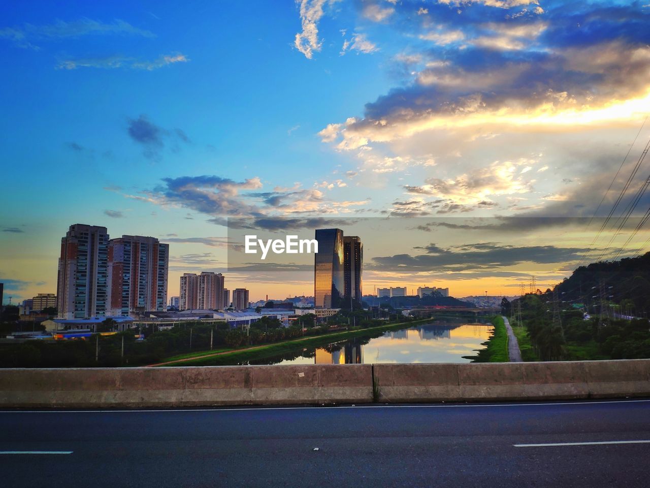 City buildings against sky during sunset