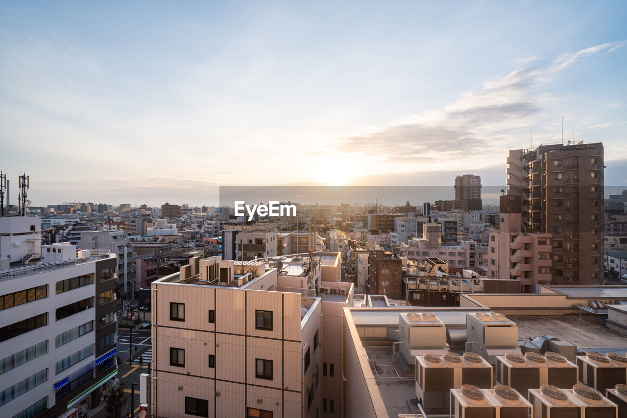 High angle view of buildings in city against sky