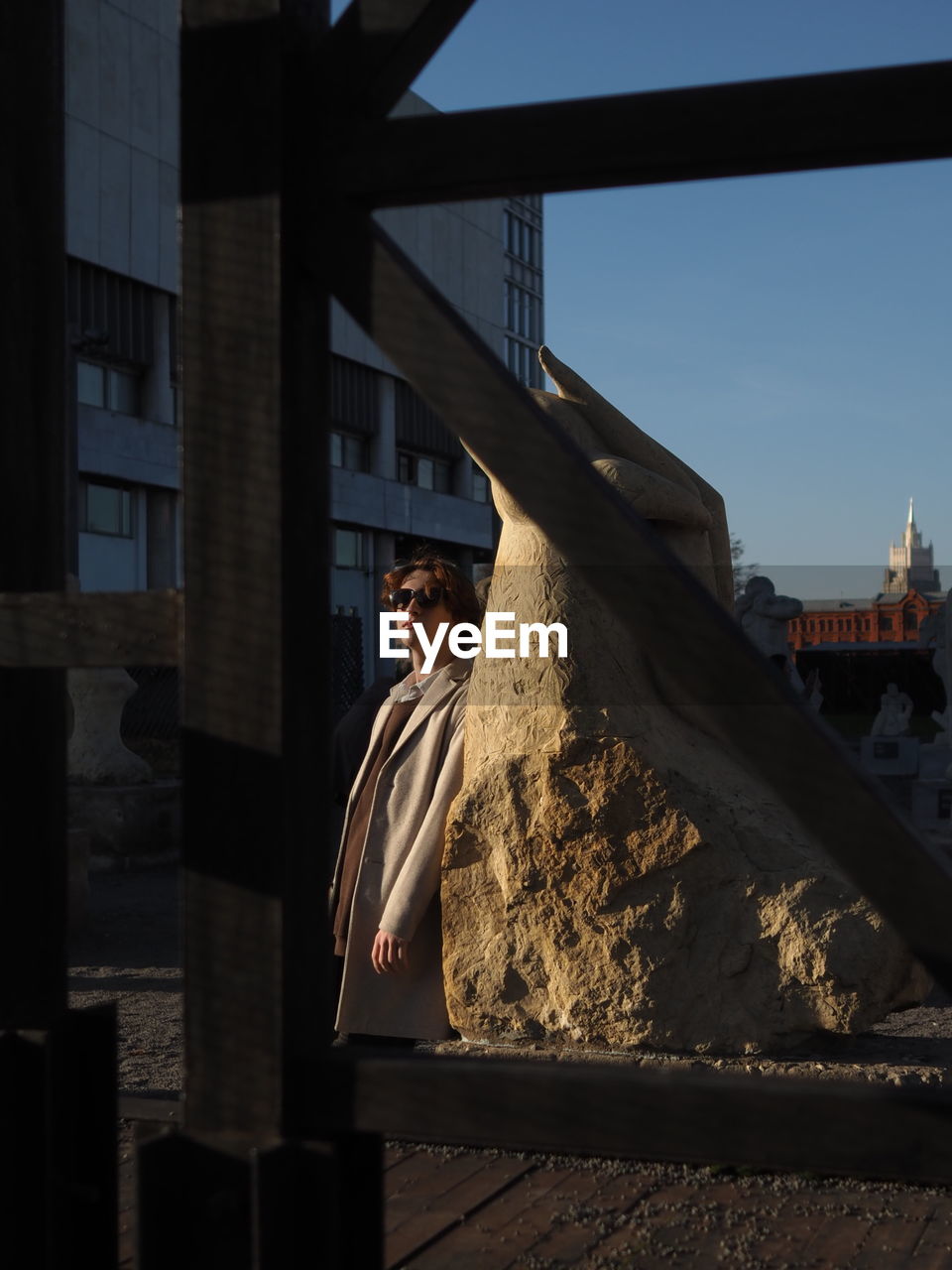 Low angle view of man standing against building