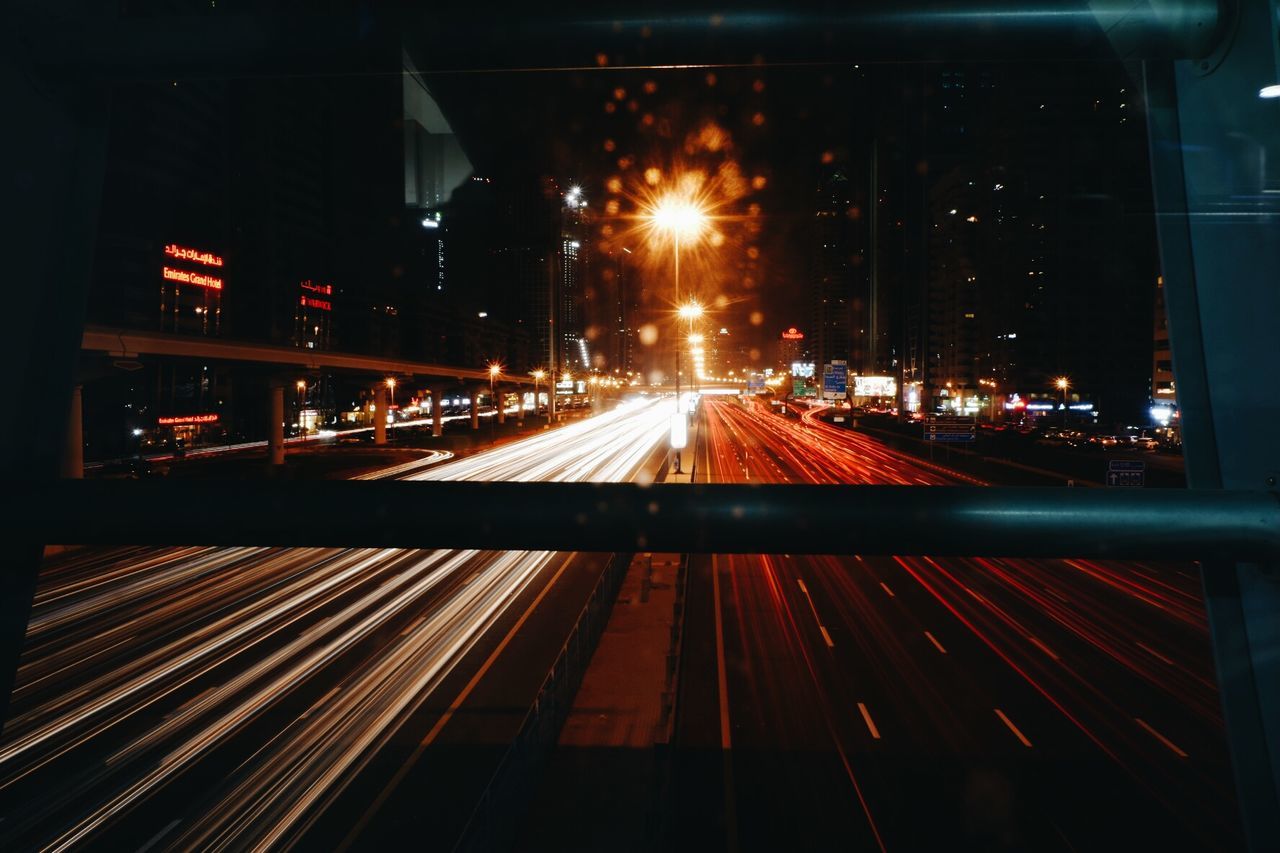 ILLUMINATED RAILROAD TRACK AT NIGHT