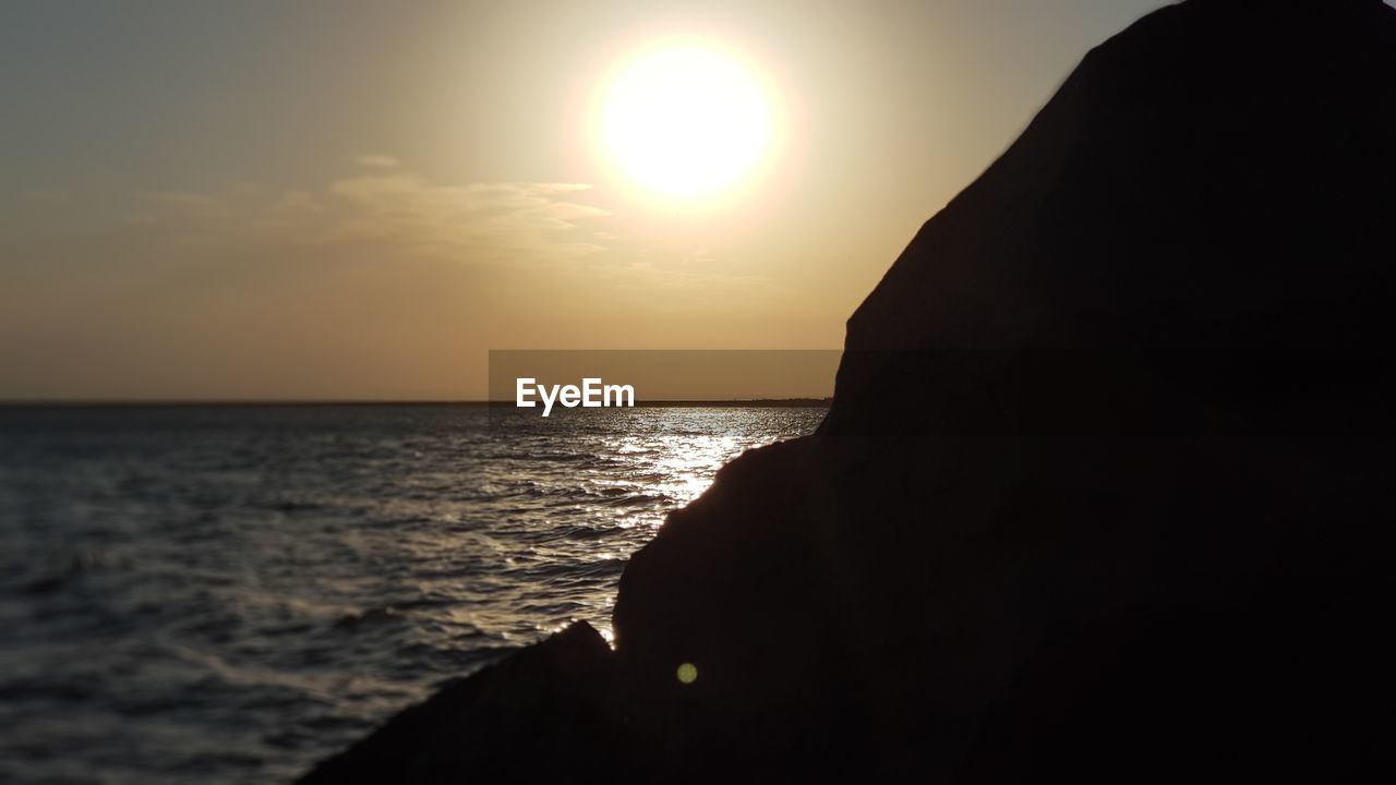 SEA AGAINST SKY DURING SUNSET