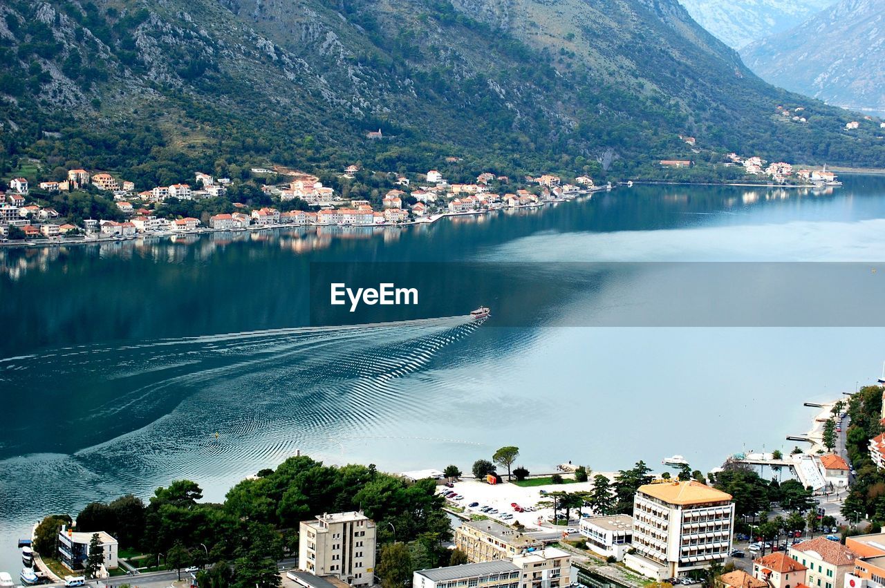 High angle view of river by town against sky