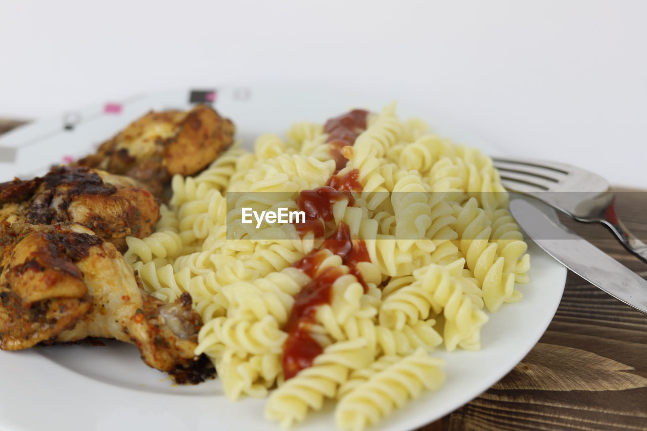 food, food and drink, fusilli, plate, rotini, freshness, cuisine, fork, dish, healthy eating, indoors, eating utensil, wellbeing, meal, pasta, kitchen utensil, close-up, meat, no people, spaghetti, vegetable, italian food, produce, vegetarian food, fast food, still life, table, dinner