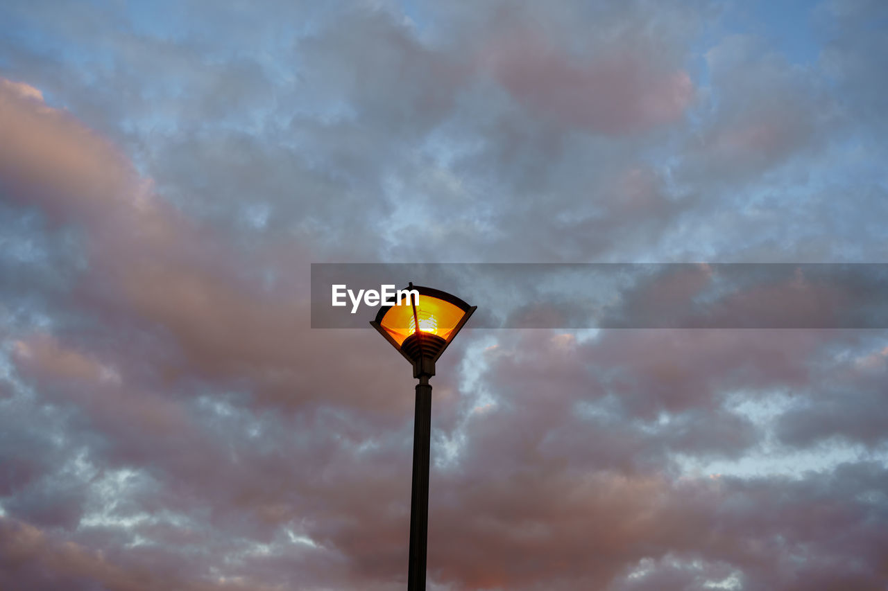 LOW ANGLE VIEW OF STREET LIGHT AGAINST SKY