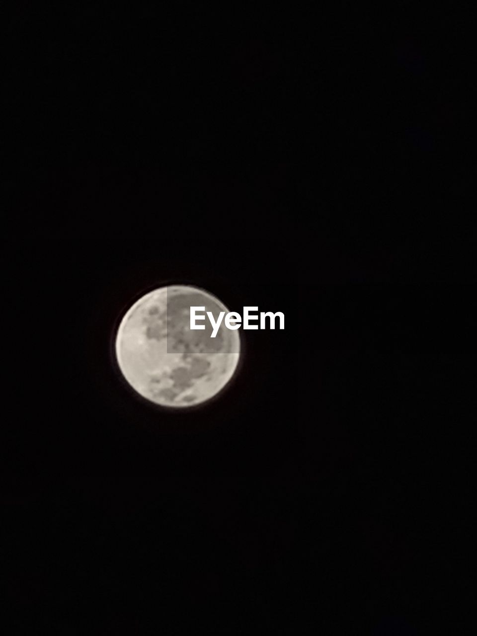 LOW ANGLE VIEW OF MOON AGAINST DARK SKY