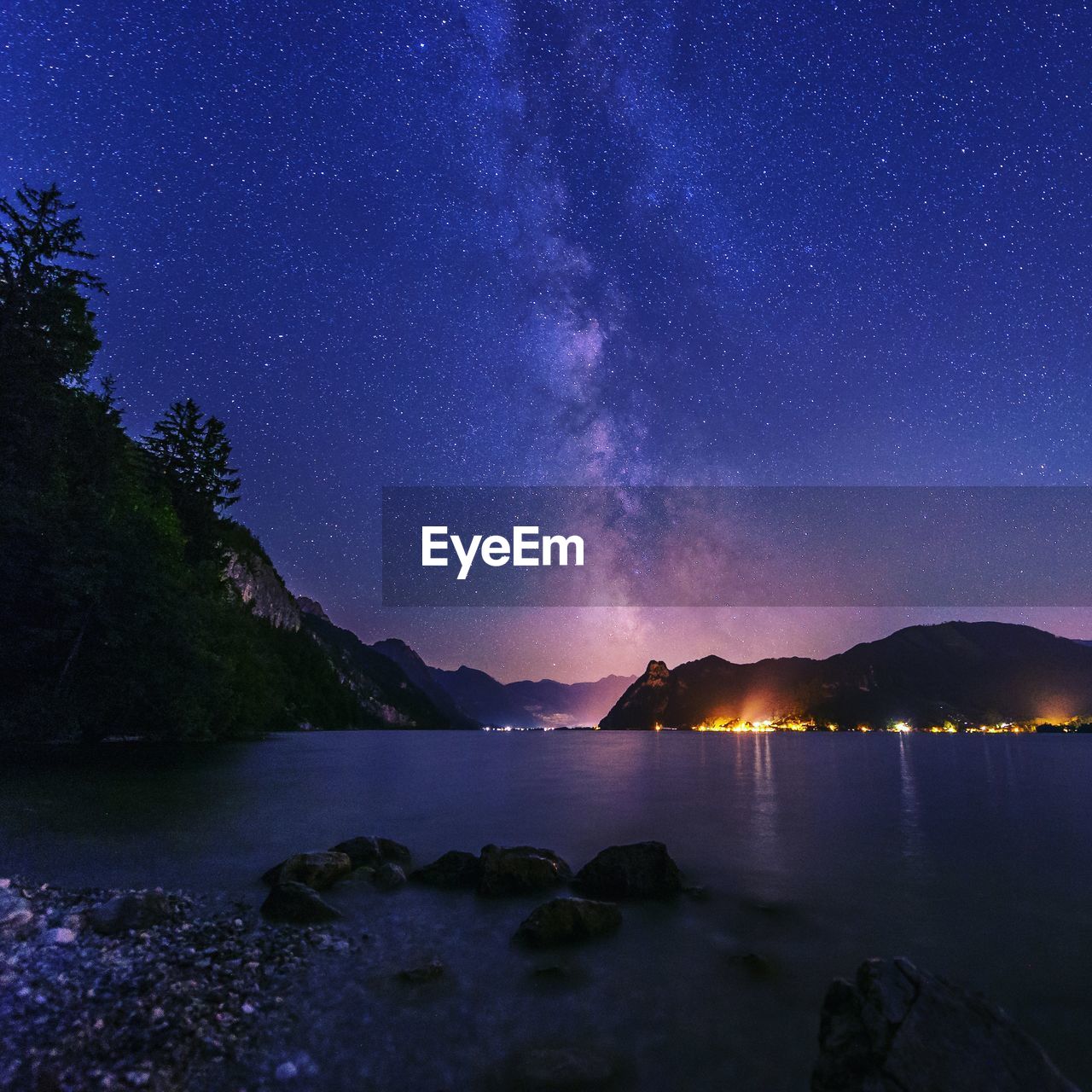 Scenic view of mountains against sky at night