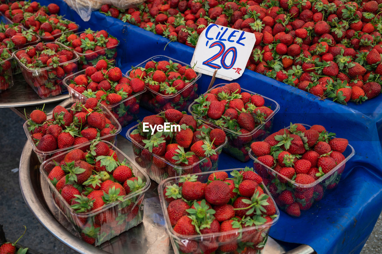 high angle view of strawberries for sale at market stall
