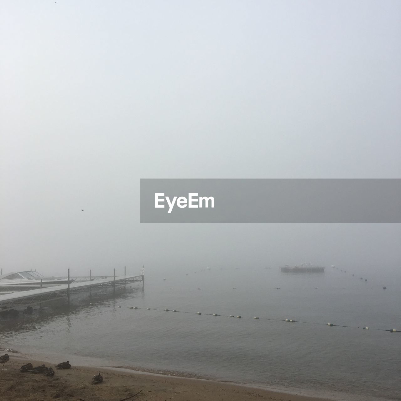 SCENIC VIEW OF SEA AGAINST SKY IN FOGGY WEATHER