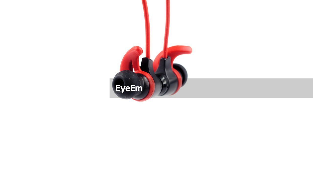 Close-up of in-ear headphones on white background