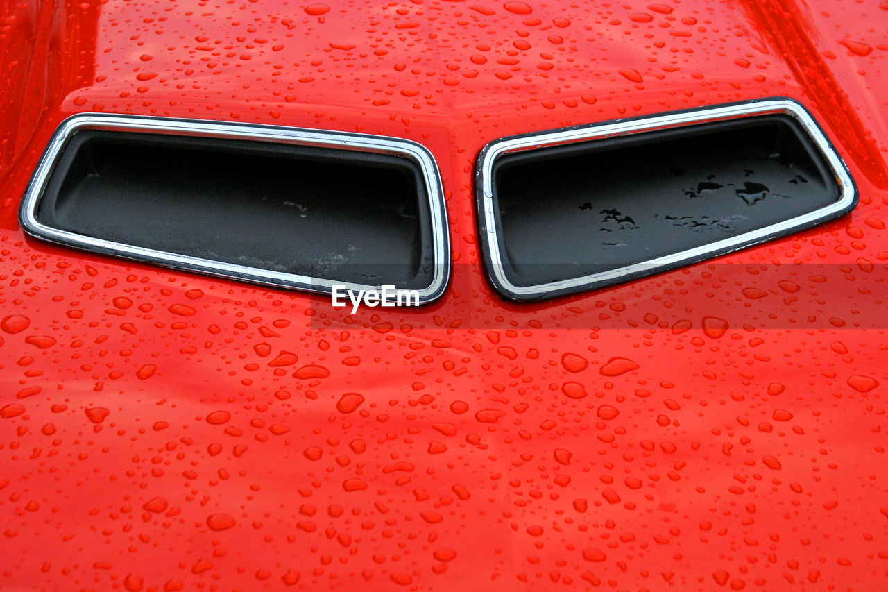 FULL FRAME SHOT OF WET RED METAL