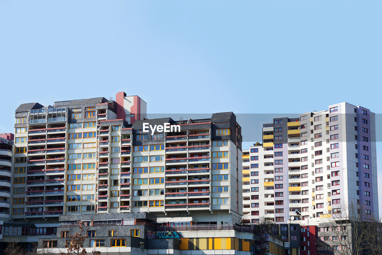 LOW ANGLE VIEW OF BUILDINGS AGAINST CLEAR SKY