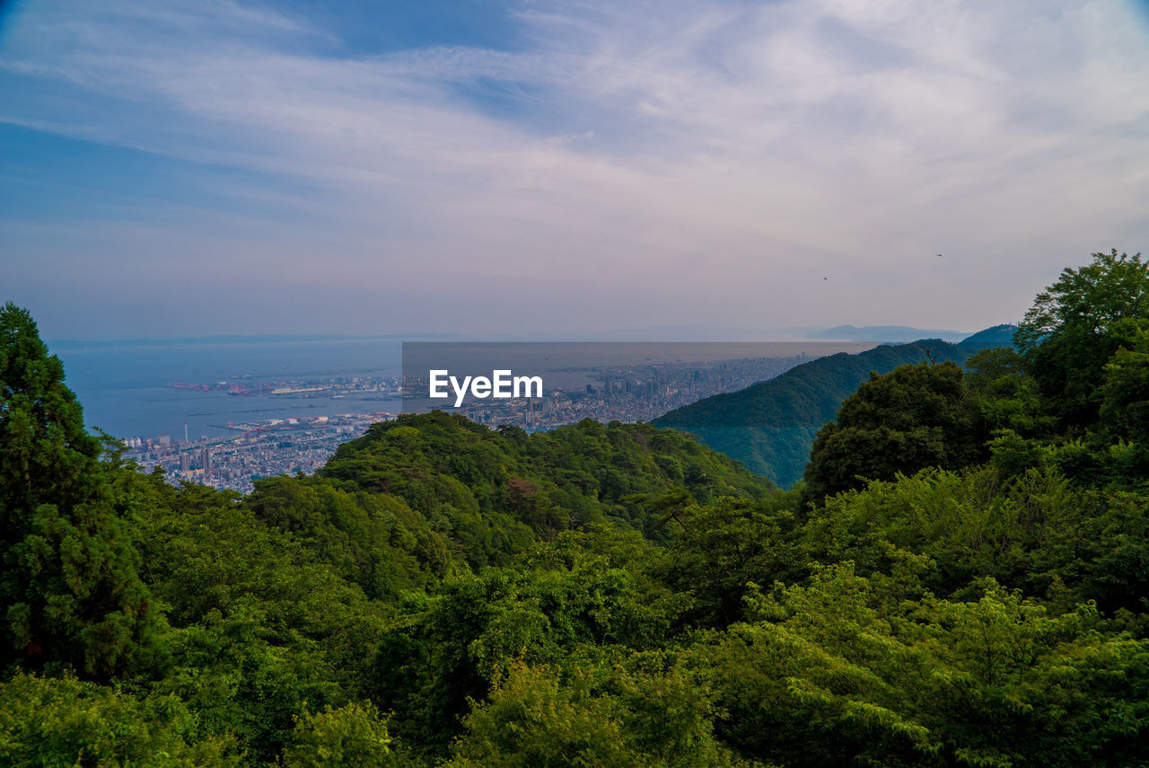 Scenic view of sea and mountains against sky