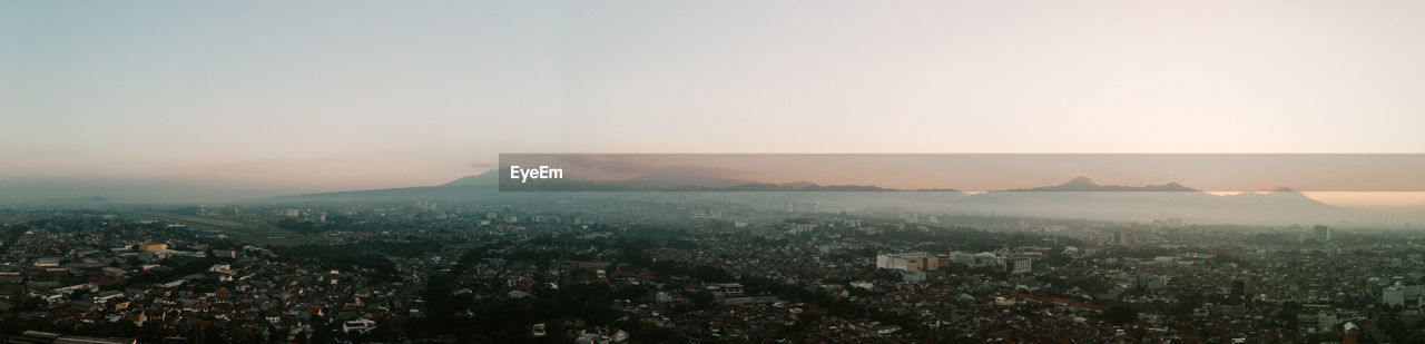 High angle view of townscape against sky during sunset