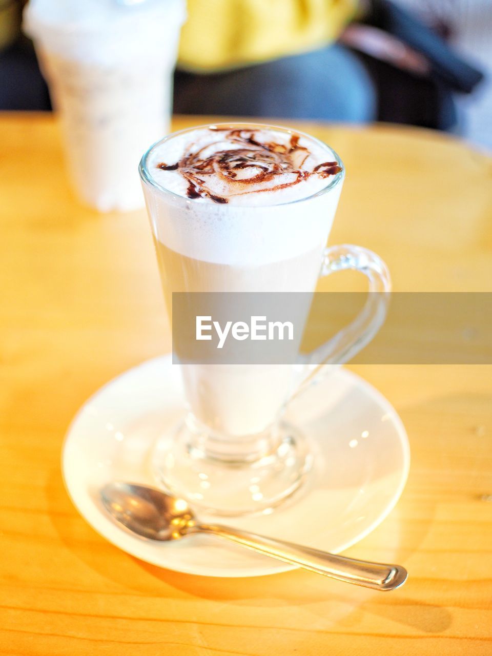 CLOSE-UP OF CAPPUCCINO ON TABLE