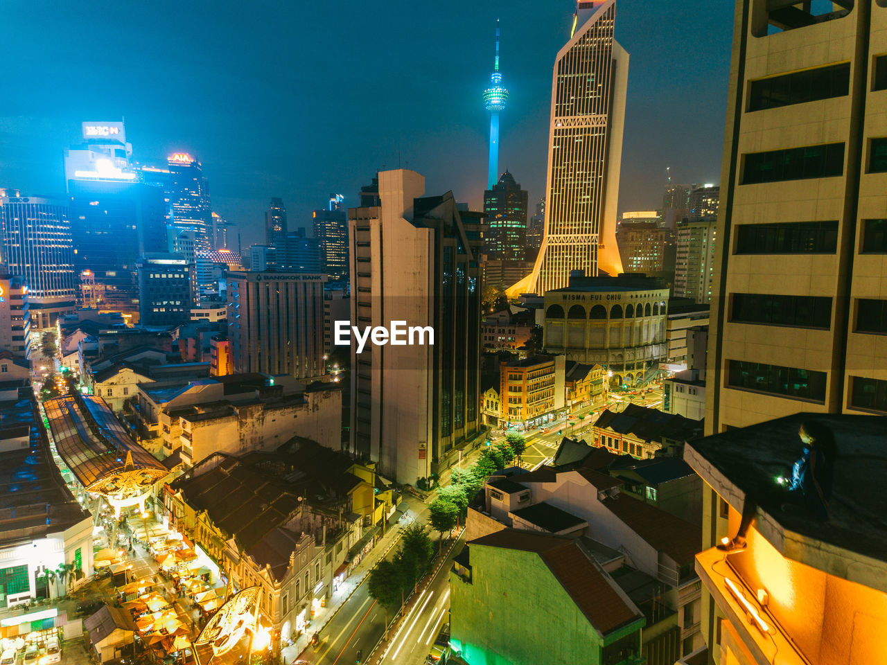 High angle view of illuminated buildings in city at night