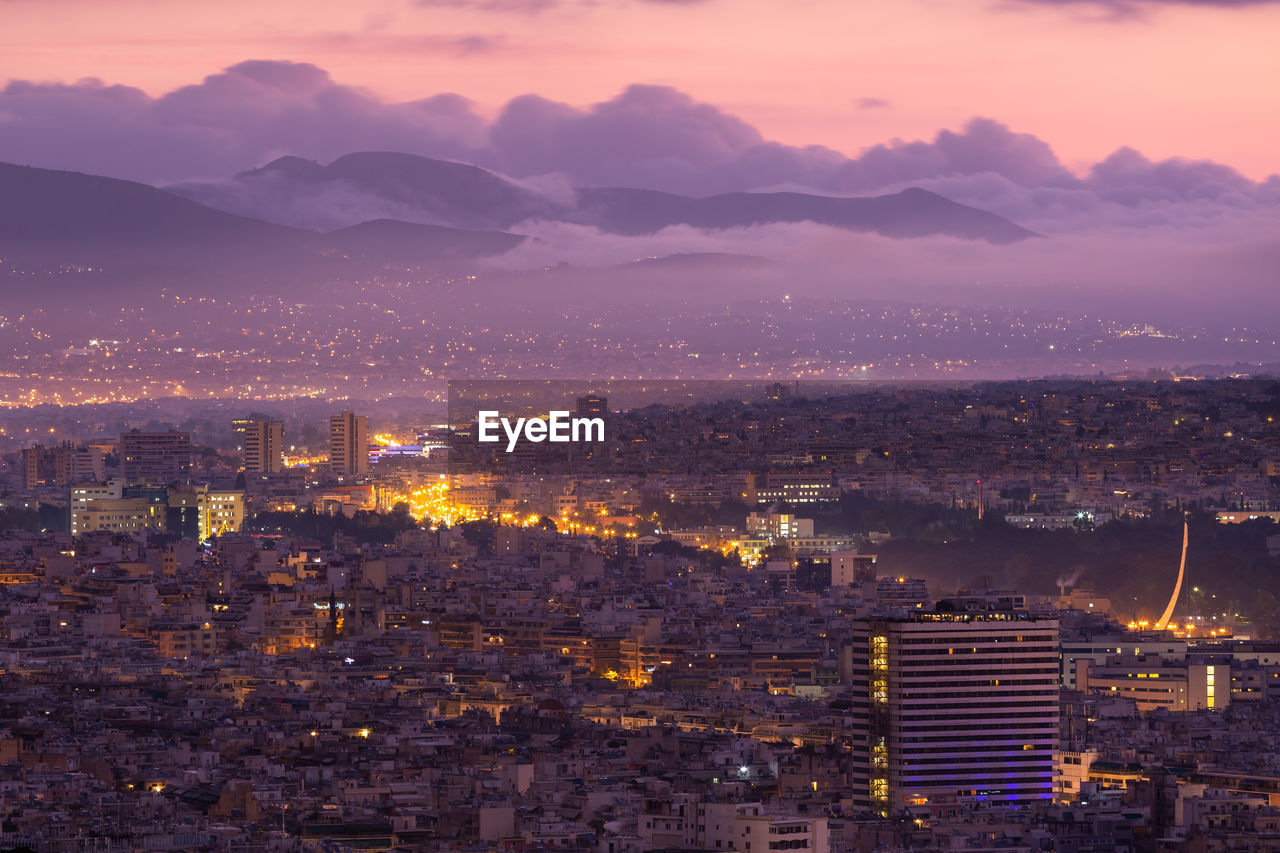 View of foggy north athens from lycabettus hill at sunrise, greece.