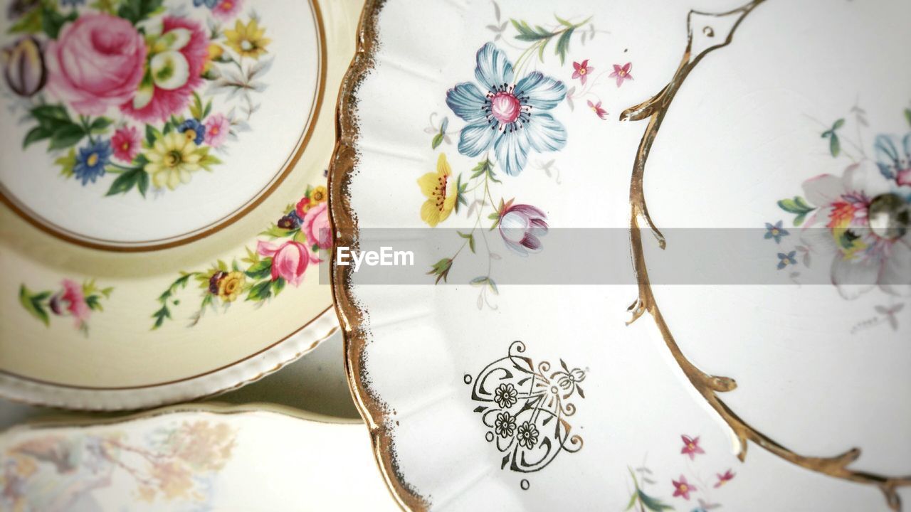 Close-up of floral pattern empty plates