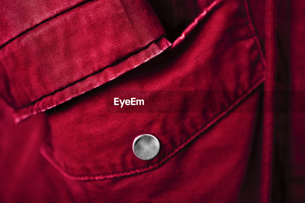 Outerwear in bright trendy color 2023 viva magenta. close-up of a textile background.