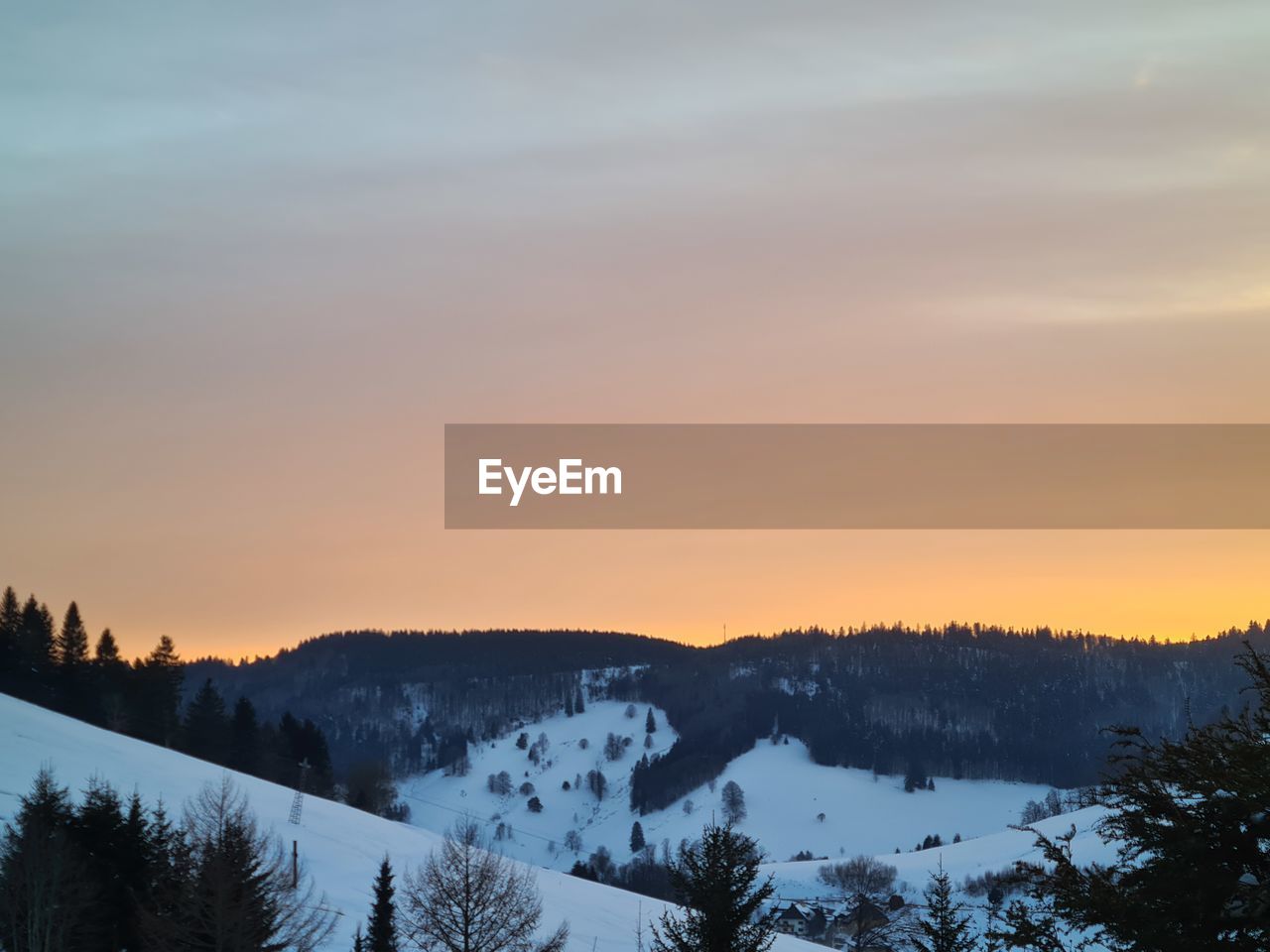 SCENIC VIEW OF MOUNTAINS AGAINST SKY DURING SUNSET