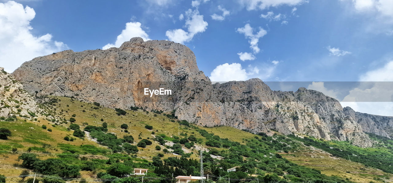 mountain, scenics - nature, sky, environment, landscape, cloud, beauty in nature, nature, land, mountain range, plant, rock, travel destinations, tree, travel, non-urban scene, valley, no people, tourism, tranquility, tranquil scene, outdoors, wilderness, rock formation, day, mountain peak, plateau, adventure, pinaceae, coniferous tree, pine tree, leisure activity, panoramic, forest, blue, idyllic, walking, semi-arid, activity, grass, green, ridge, geology, outdoor pursuit