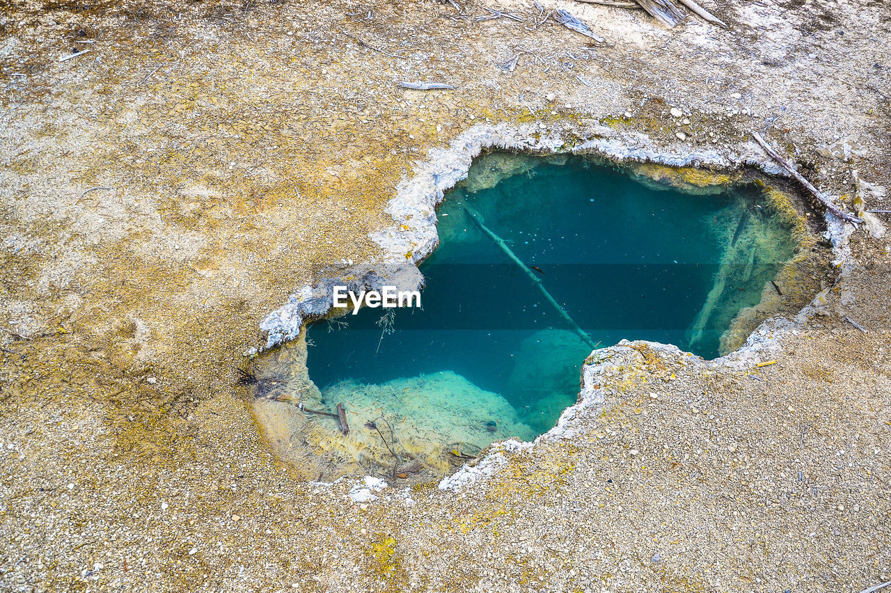 High angle view of rock in sea