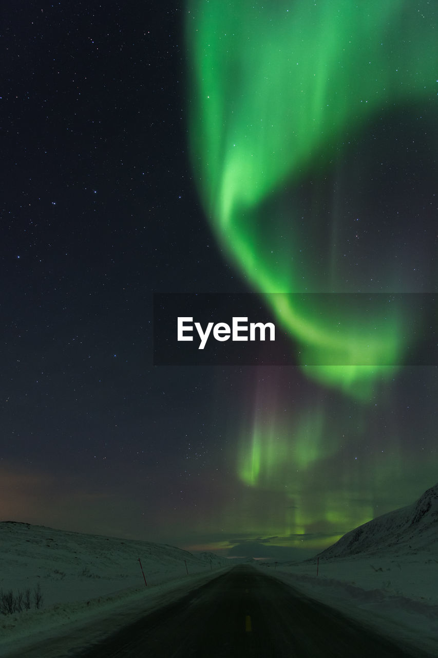 SCENIC VIEW OF SNOWY LANDSCAPE AT NIGHT