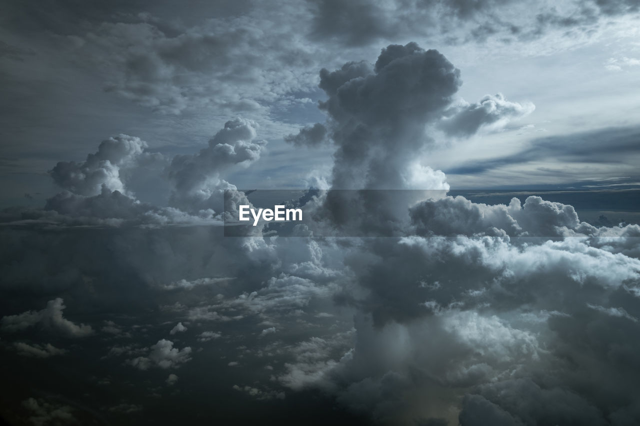 LOW ANGLE VIEW OF STORM CLOUDS OVER DRAMATIC SKY