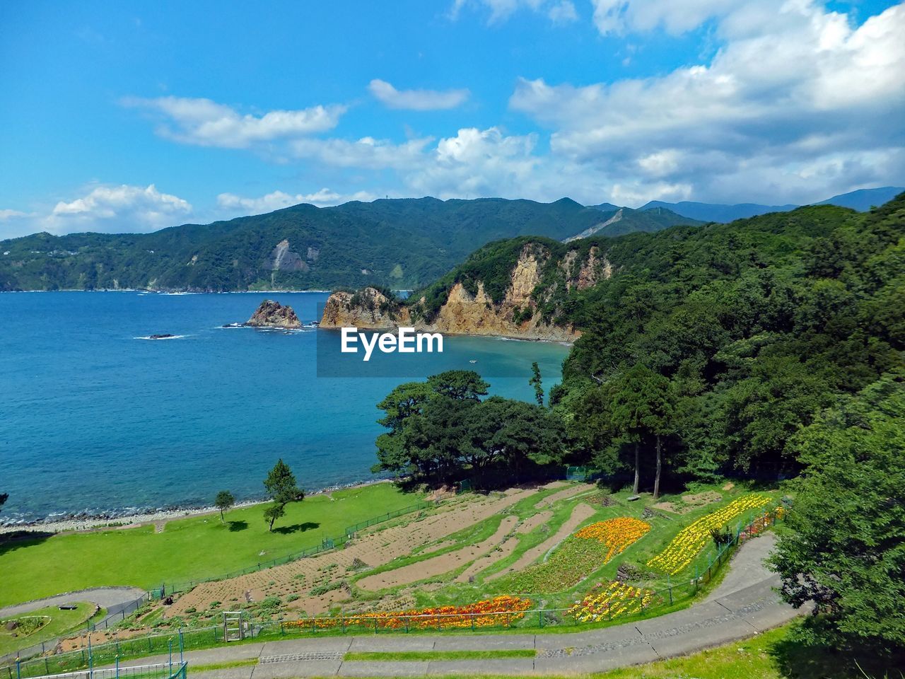 Scenic view of mountains against cloudy sky