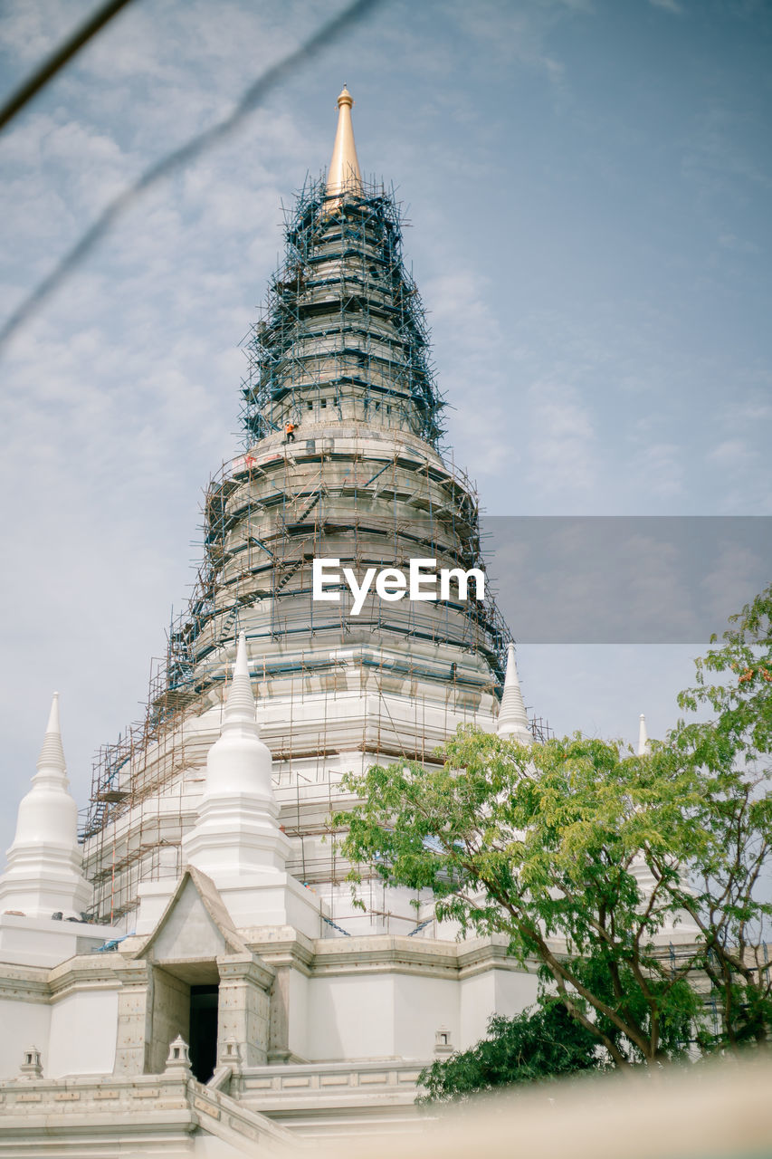 TEMPLE AGAINST BUILDING