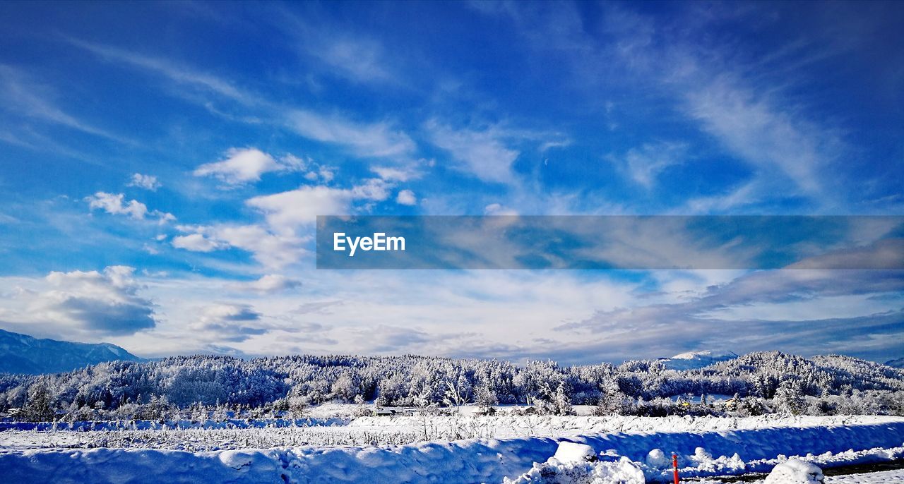 SCENIC VIEW OF SNOWCAPPED MOUNTAIN AGAINST SKY