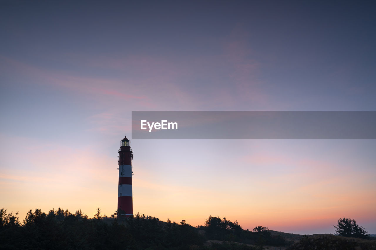 Low angle view of silhouette building against sky during sunset