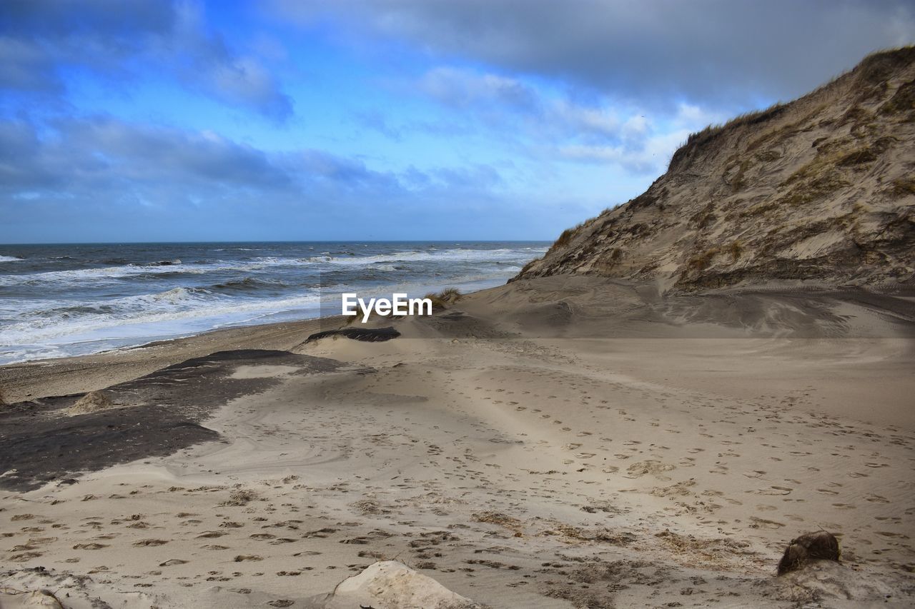 Scenic view of beach against sky