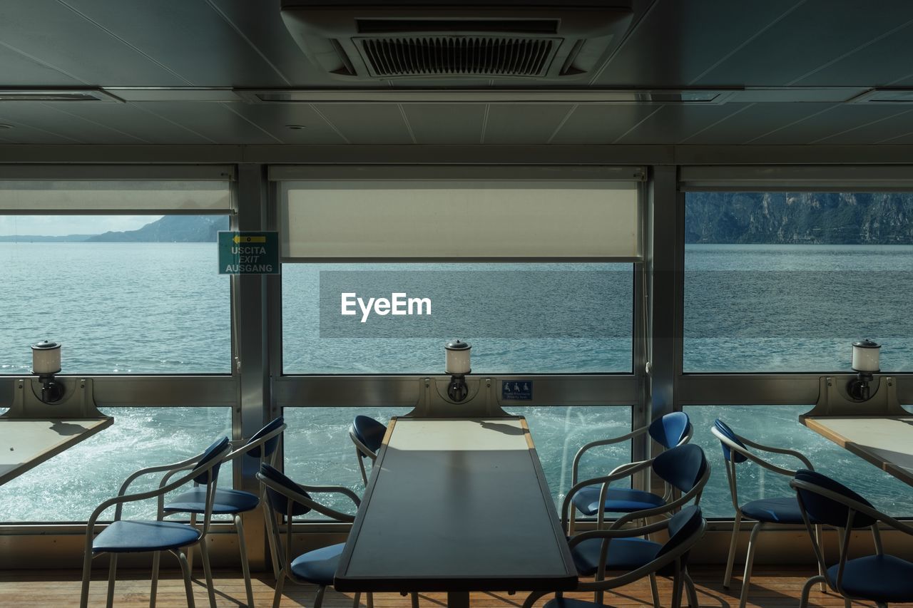 empty chairs and tables and table in restaurant