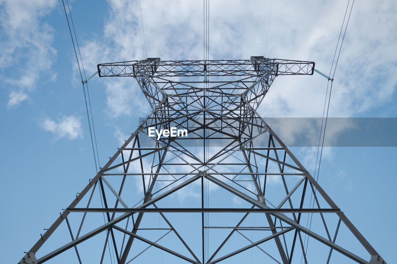 Metal pylon of a power line against the sky. 
 topics of generation and supply of electricity.