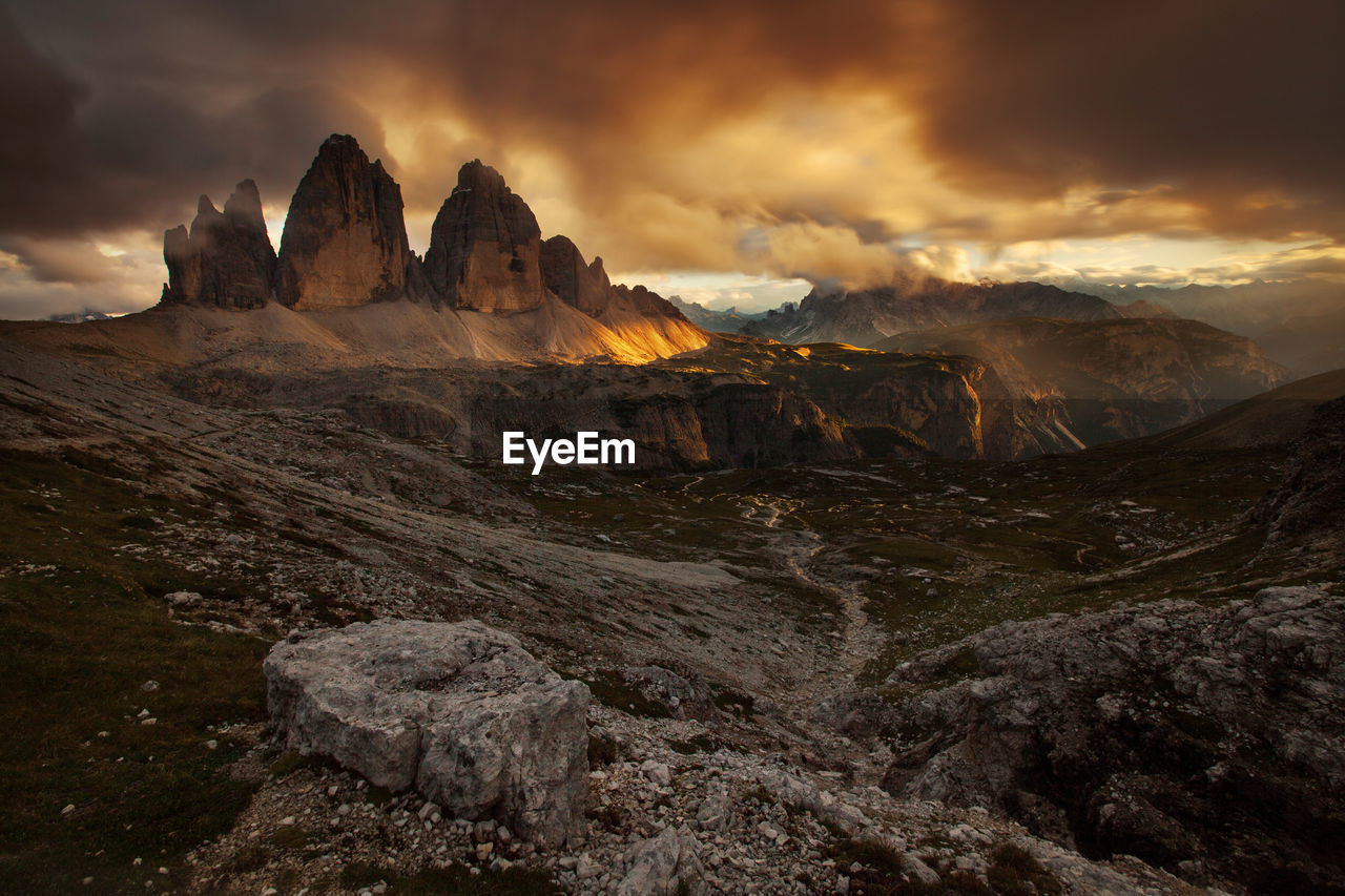 Scenic view of mountains against cloudy sky