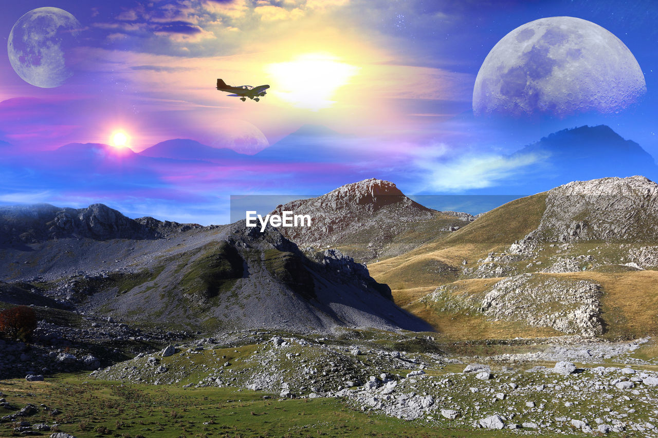 DIGITAL COMPOSITE IMAGE OF MOUNTAIN AND CLOUDS
