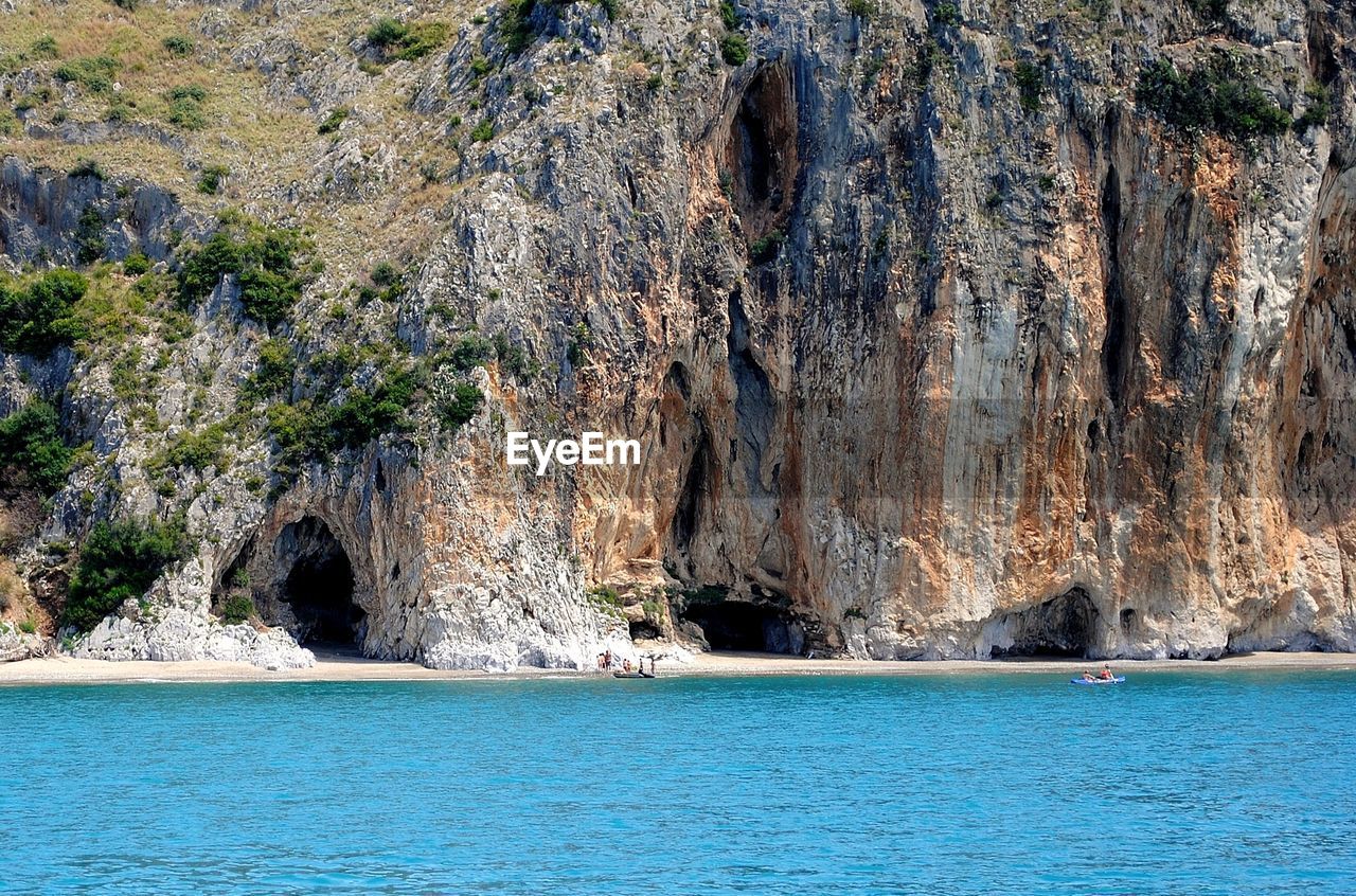 SCENIC VIEW OF SEA AND ROCK FORMATION