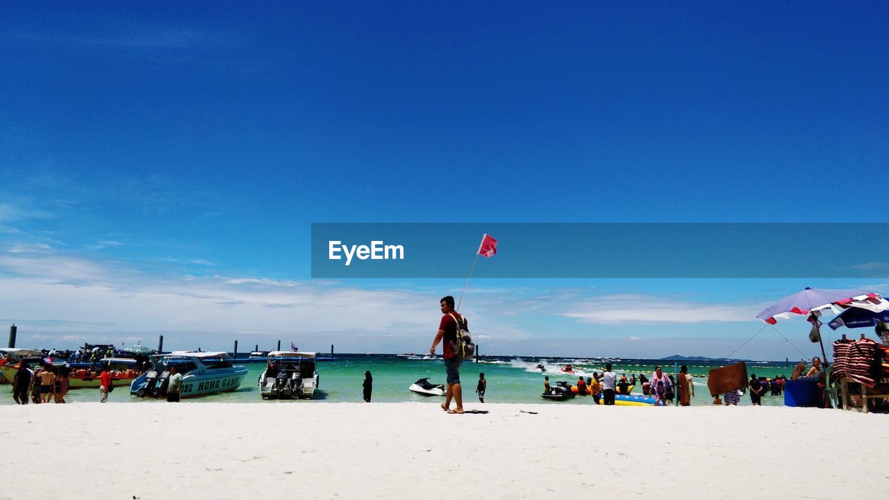 GROUP OF PEOPLE ON BEACH