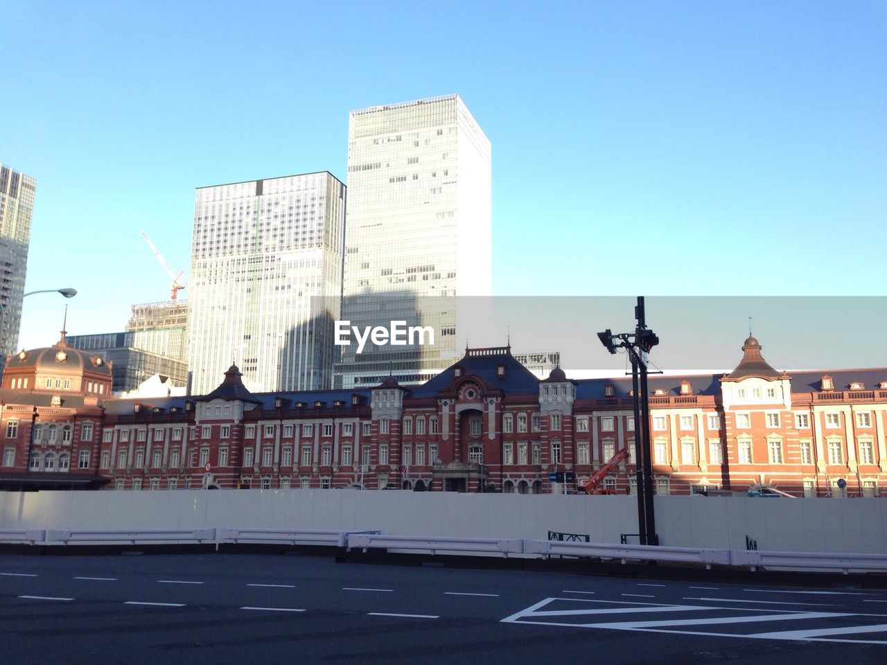 BUILDINGS IN CITY AGAINST CLEAR BLUE SKY