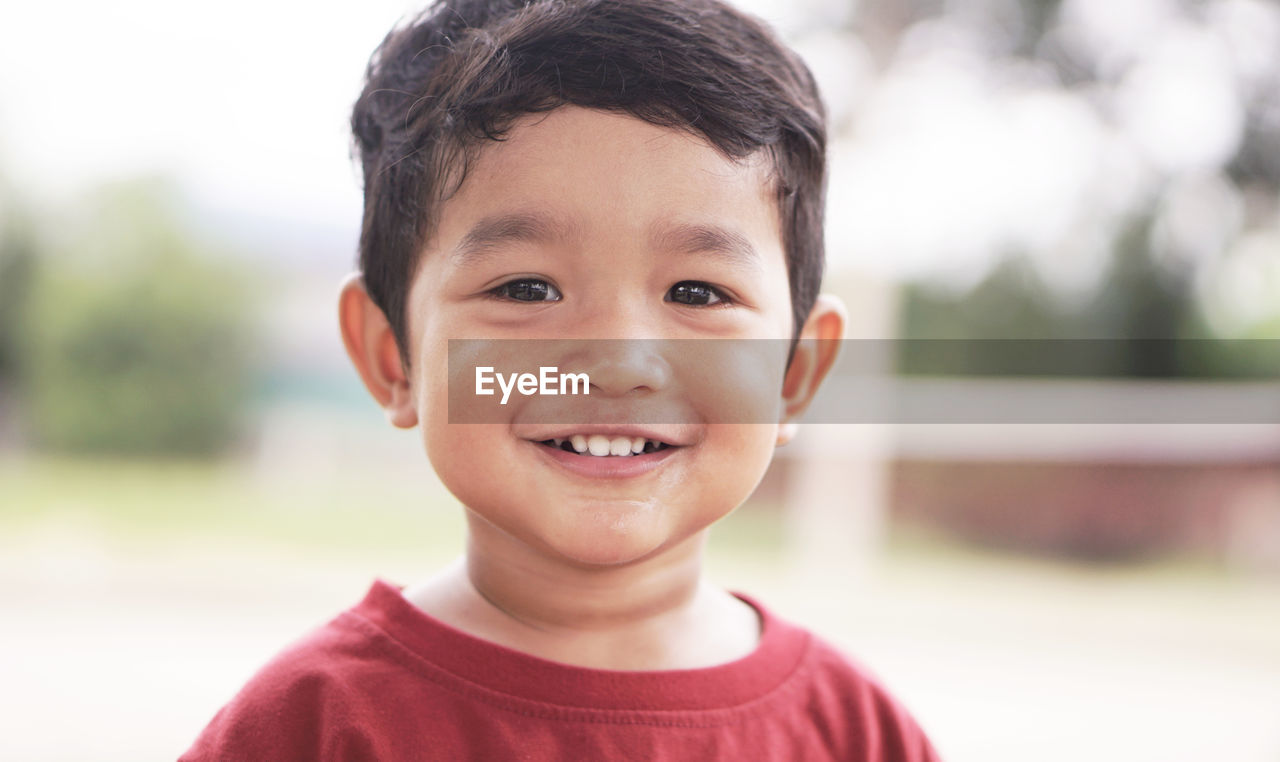 Close-up portrait of smiling boy