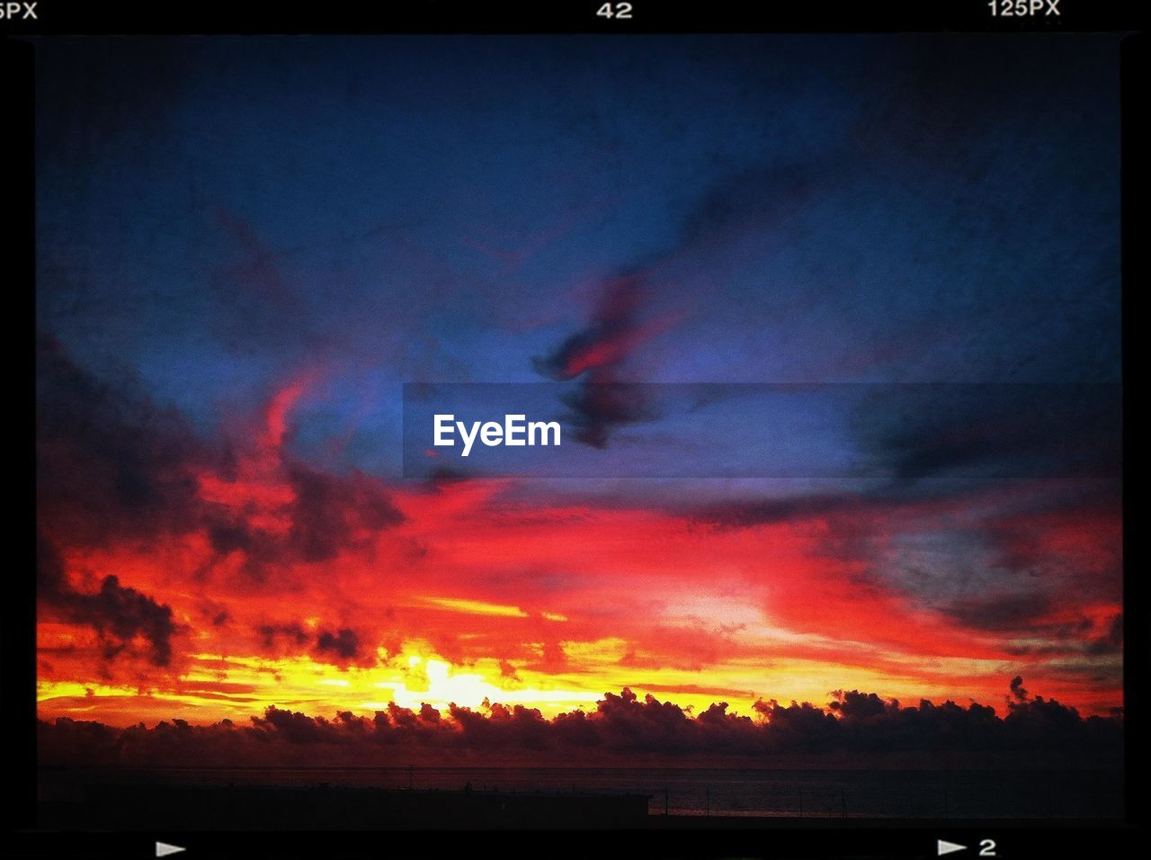 Silhouette landscape against scenic sky