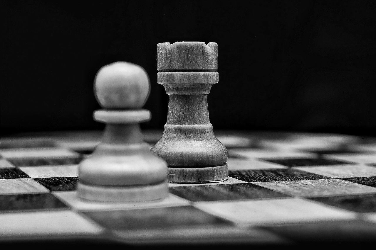 Close-up of chess pieces on board