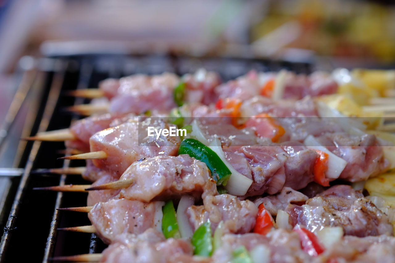 CLOSE-UP OF MEAT IN BARBECUE