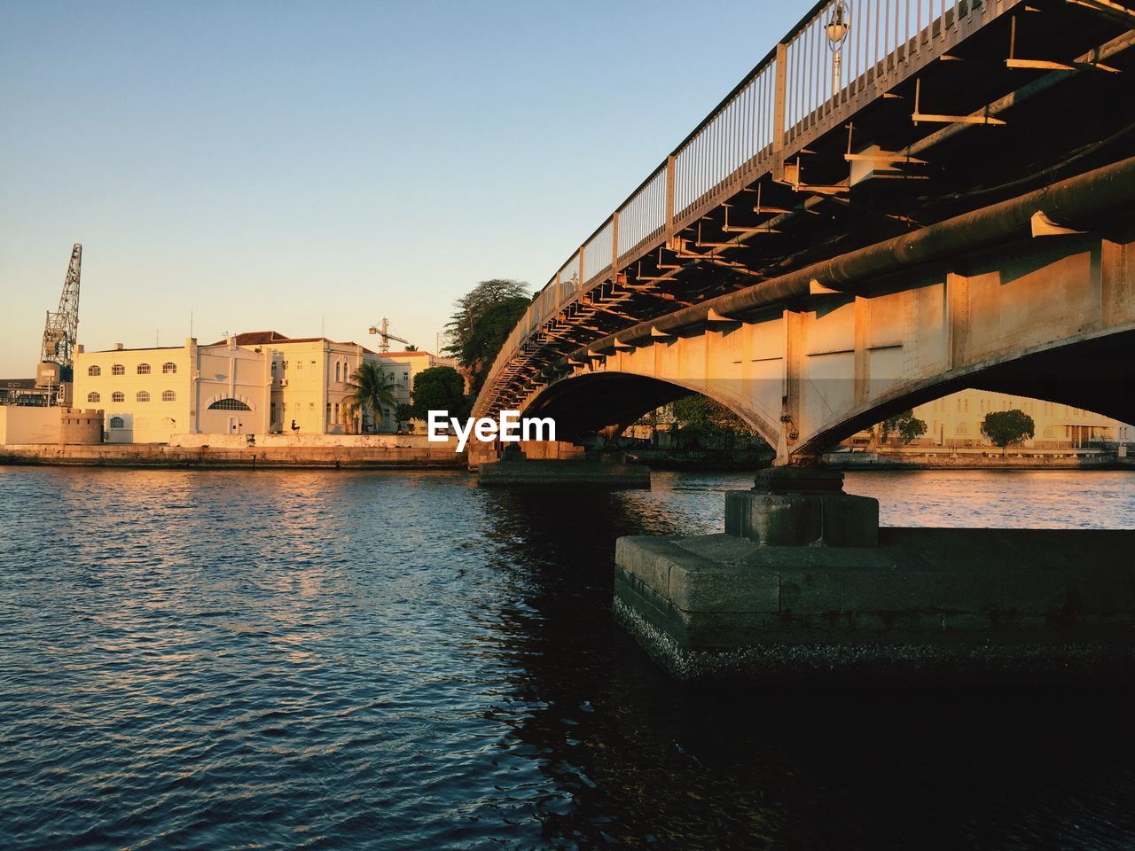 BRIDGE OVER RIVER AGAINST CLEAR SKY