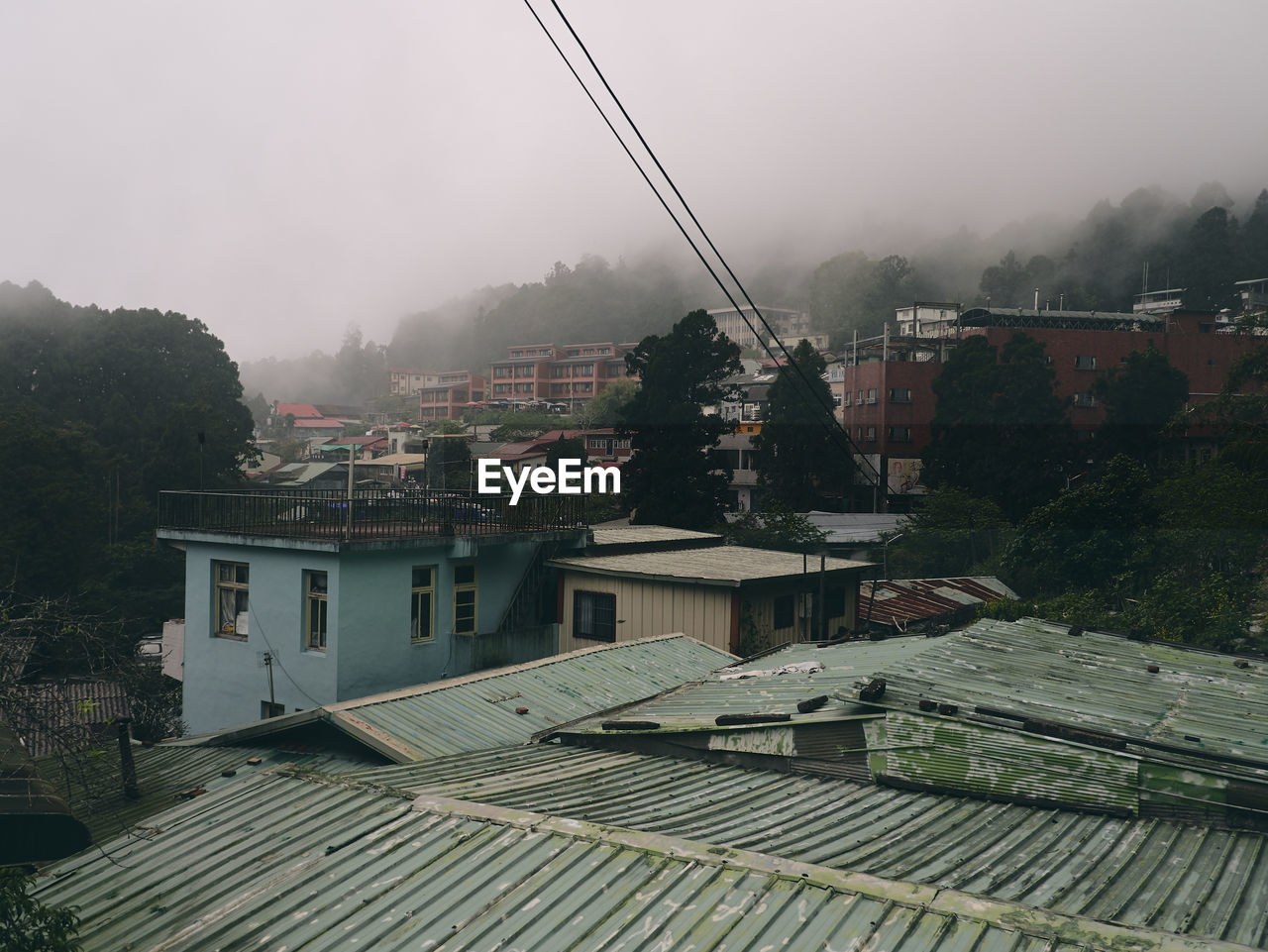 High angle view of houses and buildings in city