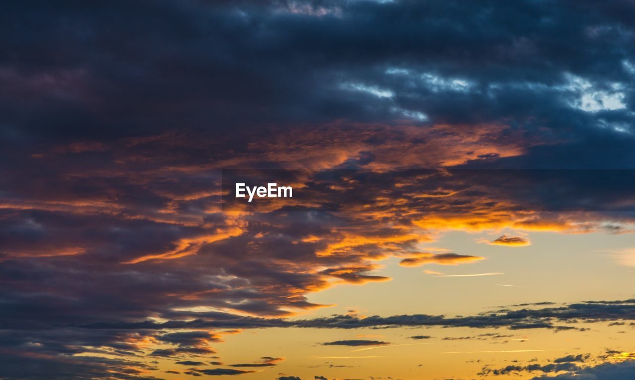 LOW ANGLE VIEW OF STORM CLOUDS IN SKY