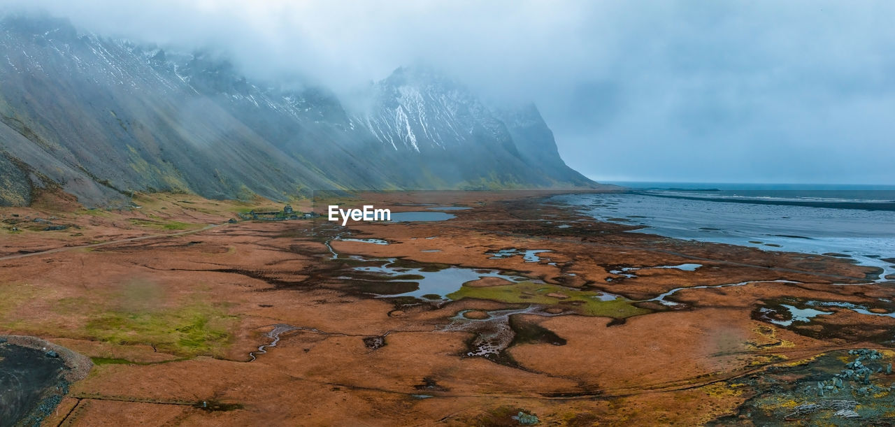 Aerial view of a viking village on a stormy rainy day in iceland.