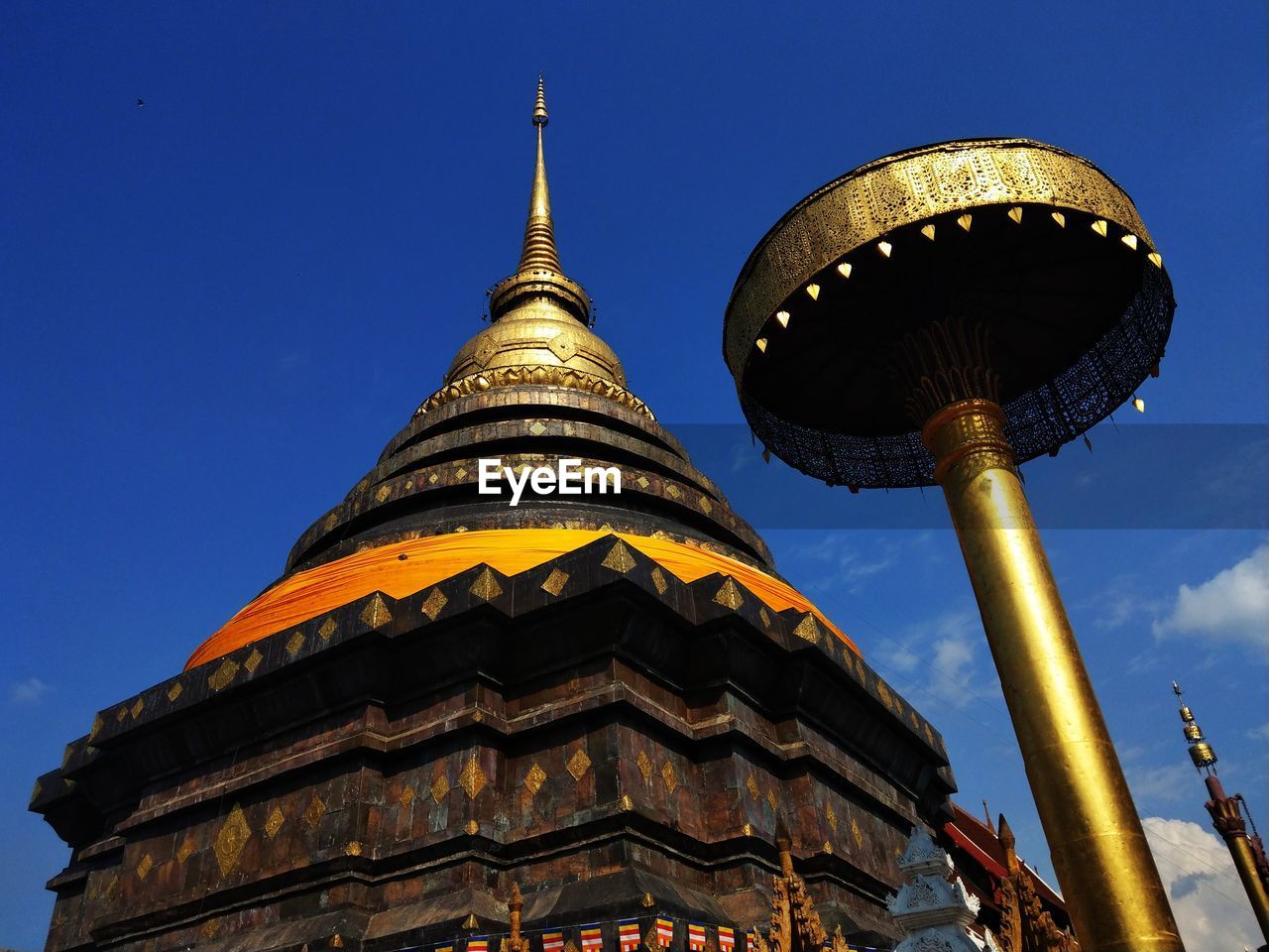 Low angle view of traditional building against blue sky